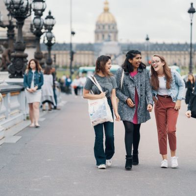 Female students walking and talking in Paris
