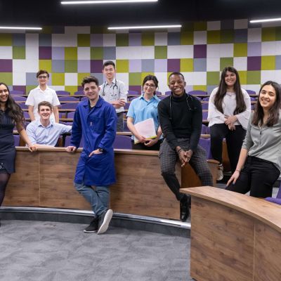 St Georges students dressed in scrubs in lecture theatre