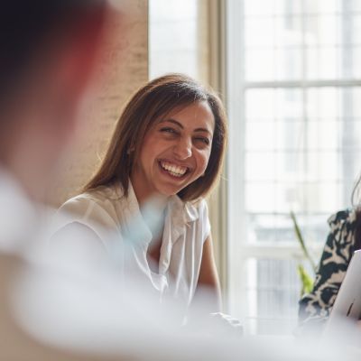 Female member of staff smiling at a coworker