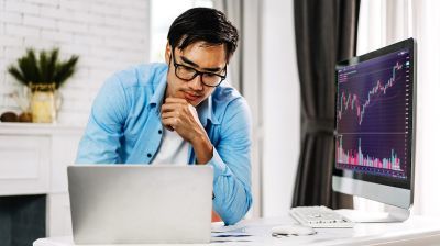 A student working on a laptop in the C++ language