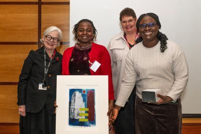 Etheldreda Mbivnjo and Juliana Yartey Enos receiving the 2024 Roger Mills Award