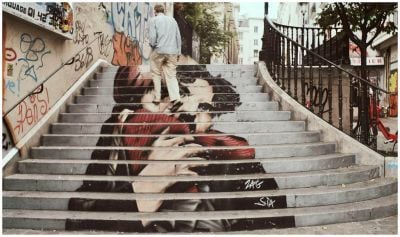 A man walking up painted steps in Paris, Frane. Photo by Dominique  ROELLINGER : https://www.pexels.com/photo/man-stepping-on-staircase-2767742/