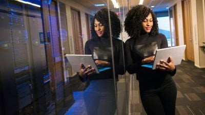 Professional data engineer by the servers at work