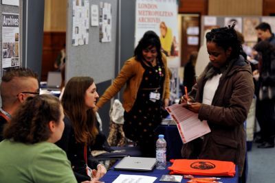 Collections staff talk to a visitor at the second event in January 2015