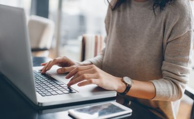 Woman typing on laptop