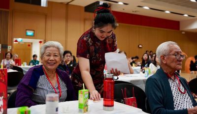 Erine Tong hosting for senior citizens at a festival