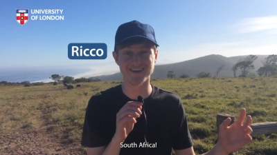 Ricco holding a microphone