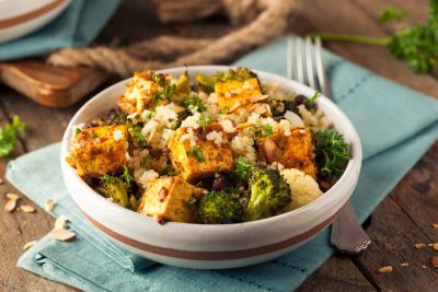 Bowl of food containing tofu and quinoa