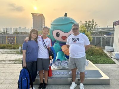 Adelia with her parents at the 2023 Asian Games in Hangzhou, China