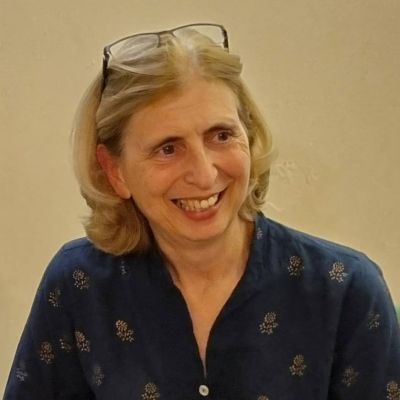 Patricia McKellar smiling wearing a blue blouse.