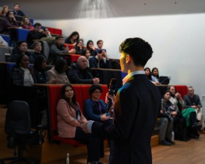 Student addresses attendees at LSSC25