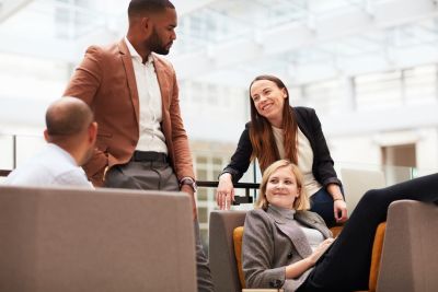 Postgraduate students in a breakout area